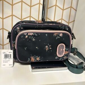 New with tag. Beautiful Coach Floral Print Nylon Court Crossbody Purse.
